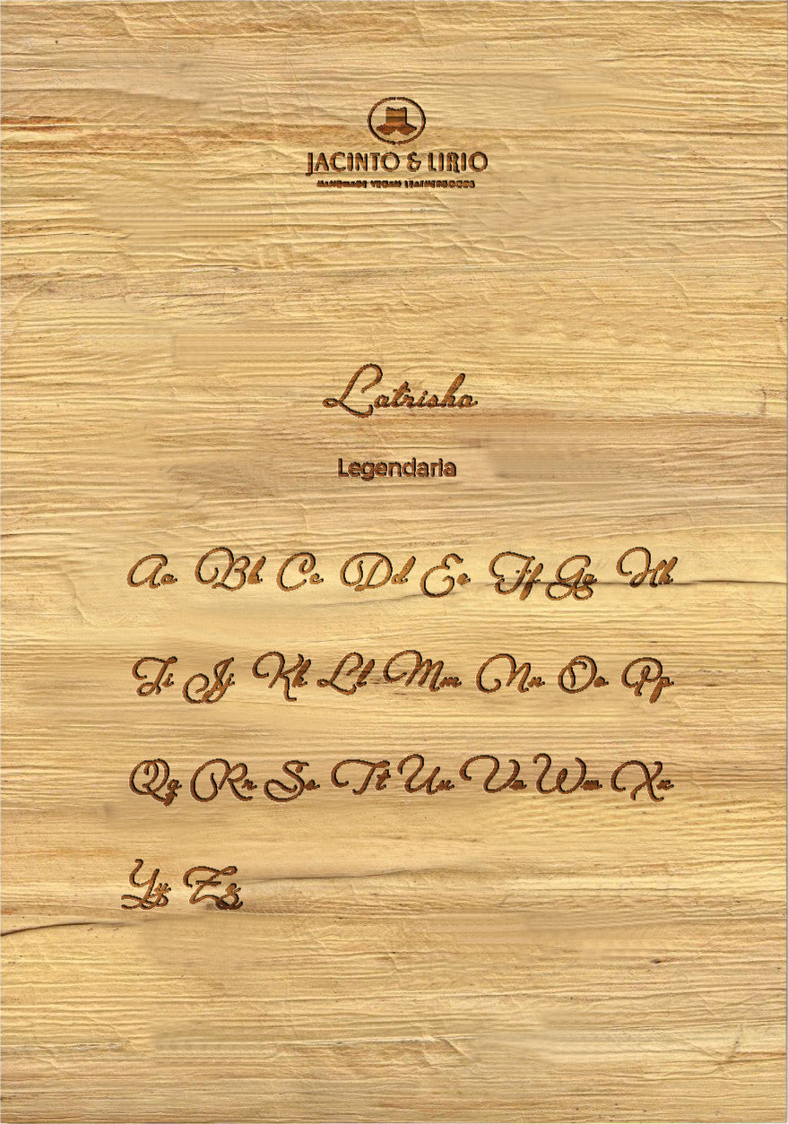 The name "Latrisha" laser engraved on a piece of vegan leather along with its the uppercase and lowercase alphabet engraved with the same font to showcase the full range.