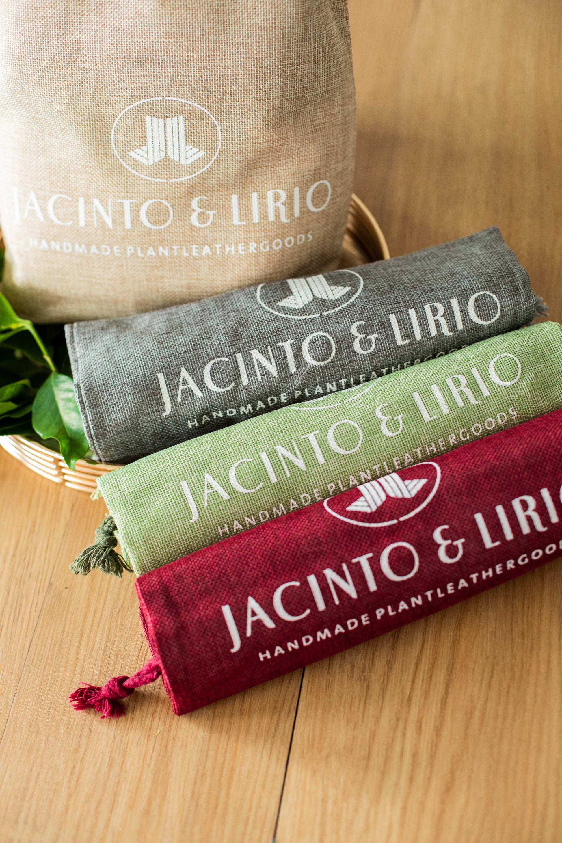 4 different drawstring bags in color red, pale green, gray, and beige.