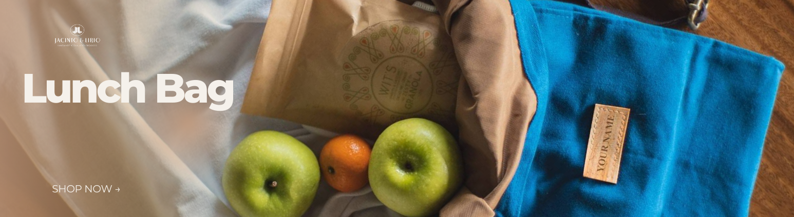 A blue lunch bag spilling out apples and a granola bag.