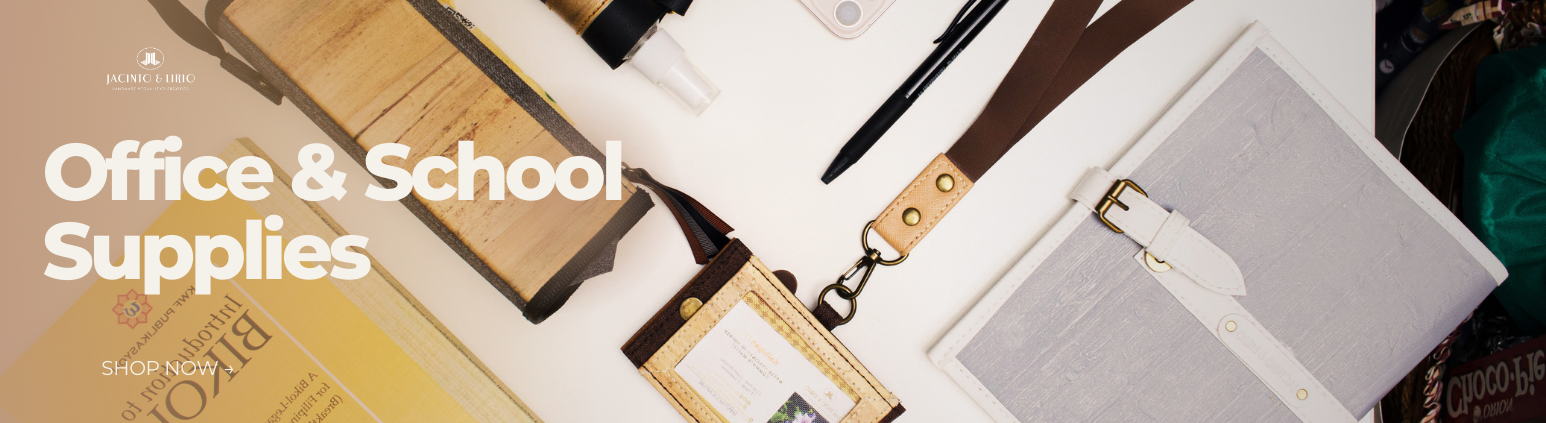 A white vegan leather journal next to a brown lanyard.