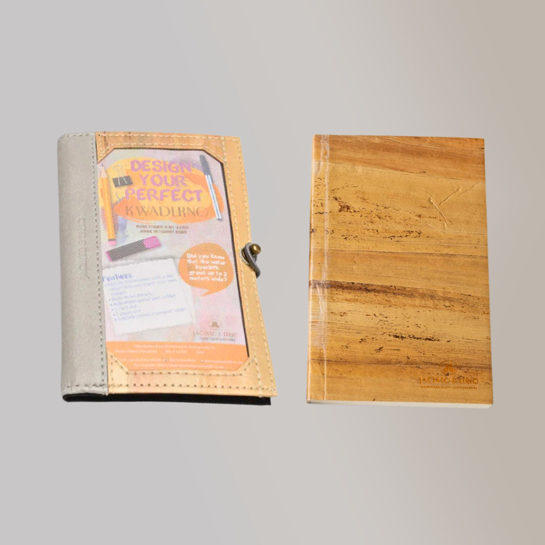 A vegan leather notebook with a gray leather spine, beside notebook refills from Jacinto & Lirio