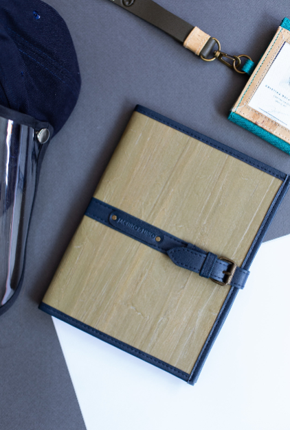 A leather notebook with matching box and page refills.