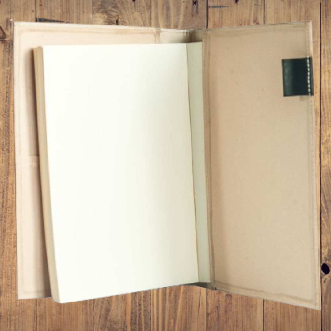 Opened Jacinto & Lirio Spes Medium Journal on brown table