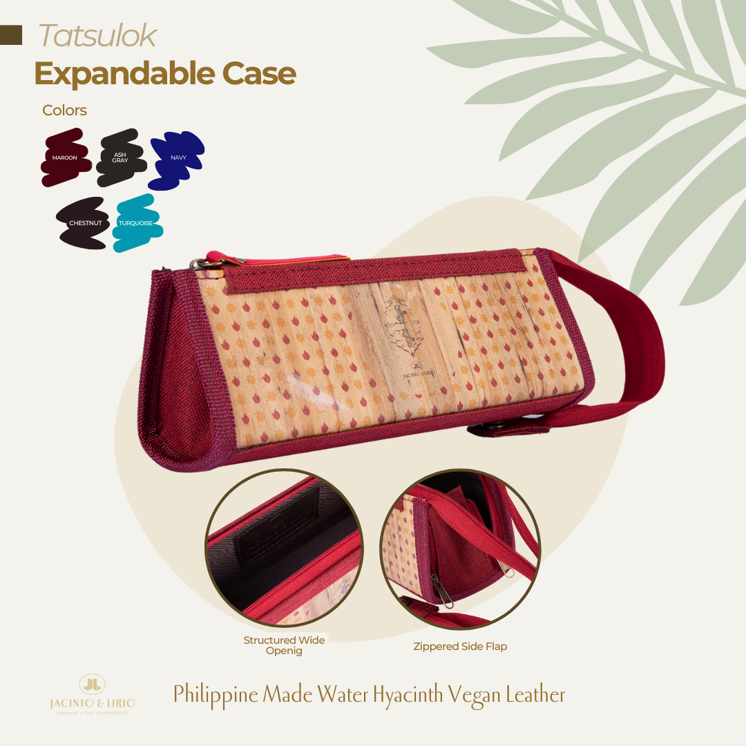 A maroon triangular pencil case that is expandable and has a vegan leather exterior.