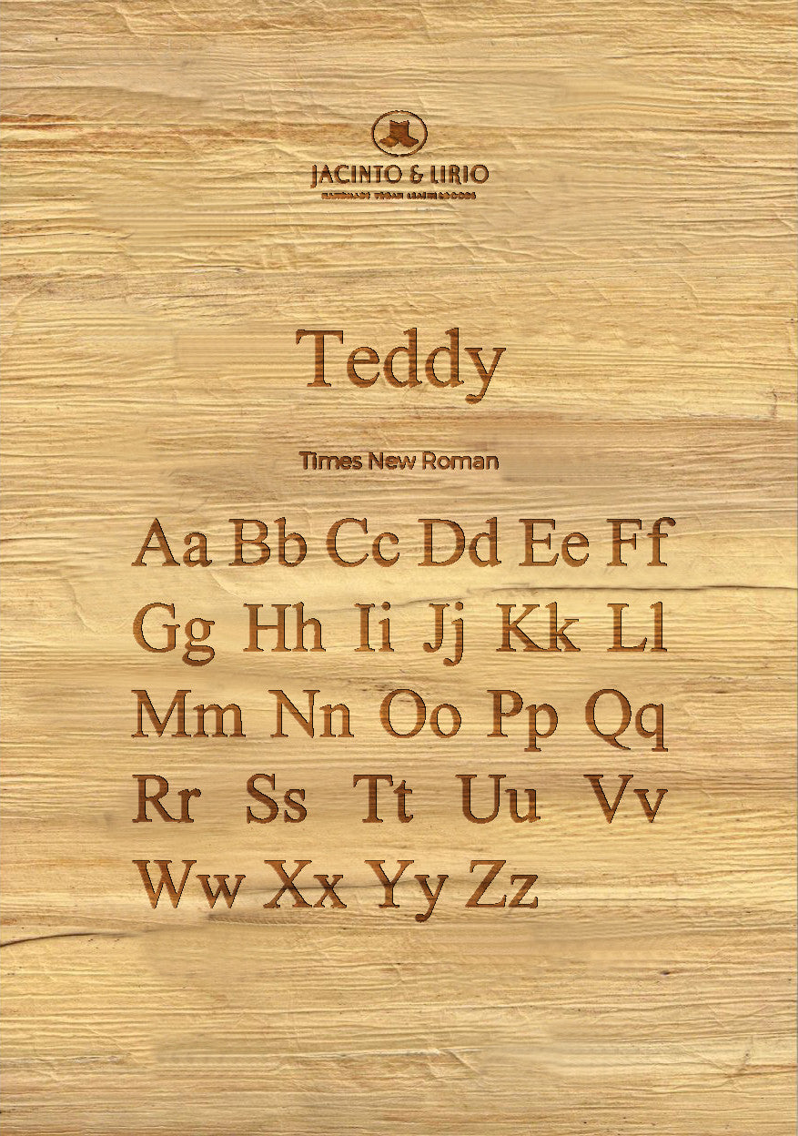 The name "Teddy" laser engraved on a piece of vegan leather along with its the uppercase and lowercase alphabet engraved with the same font to showcase the full range.