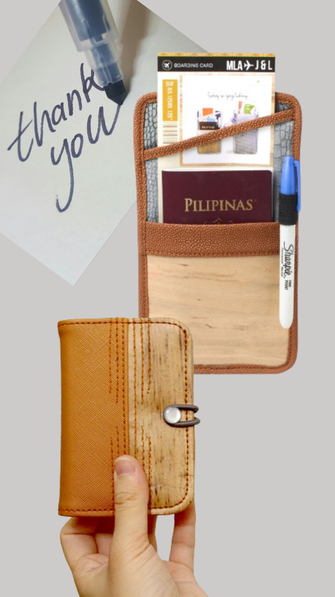 A hand holding up a brown vegan leather card wallet, with a flat passport holder in the background, as well as a blue marker writing the words "thank you" onto a paper.