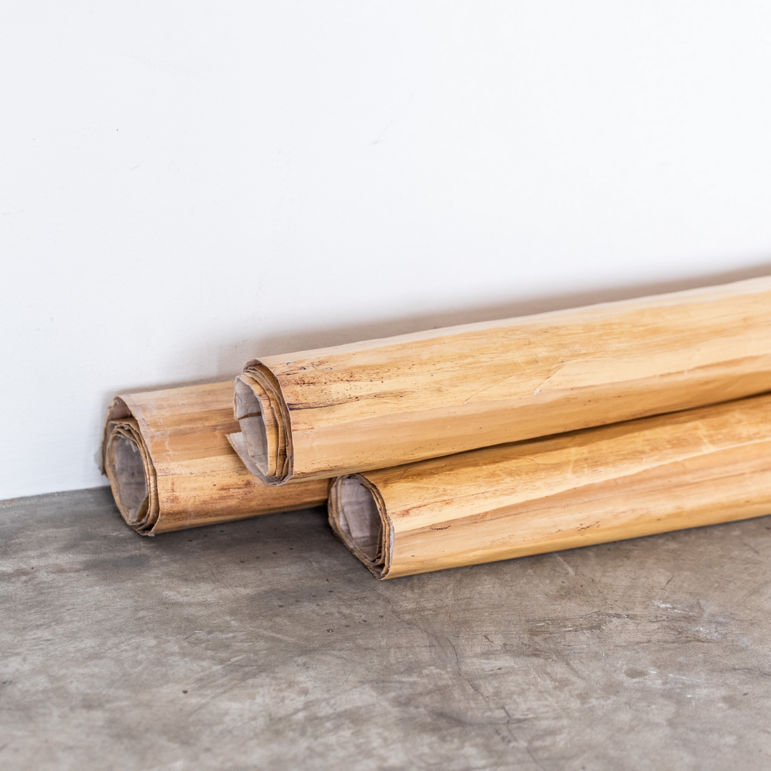 Three rolls of wallpaper made from dried water hyacinth stalks