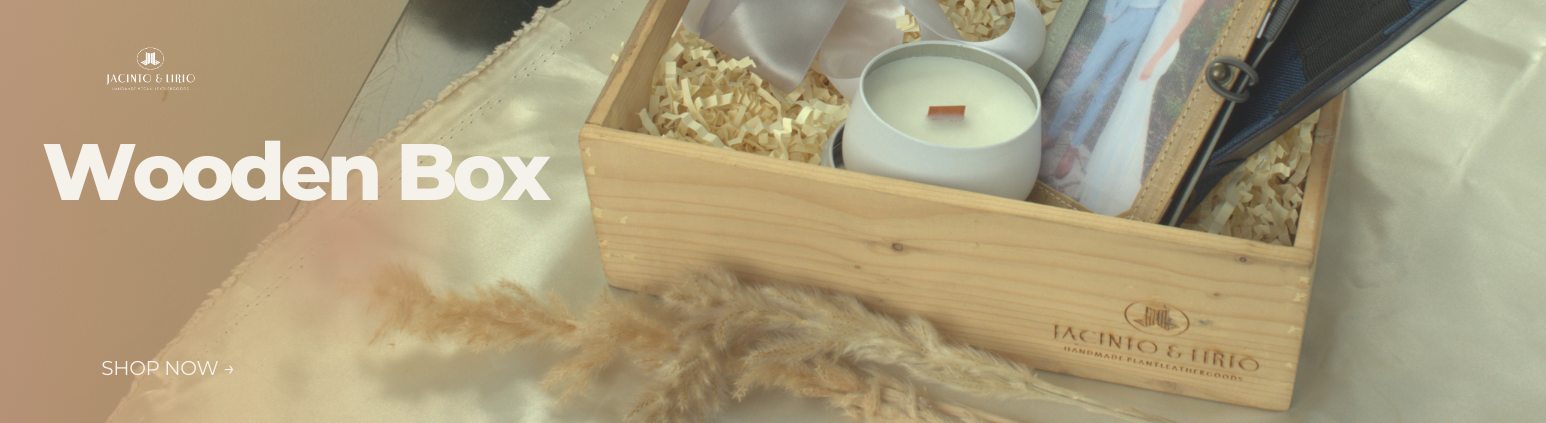A wooden box hat holds a candle and a picture frame.