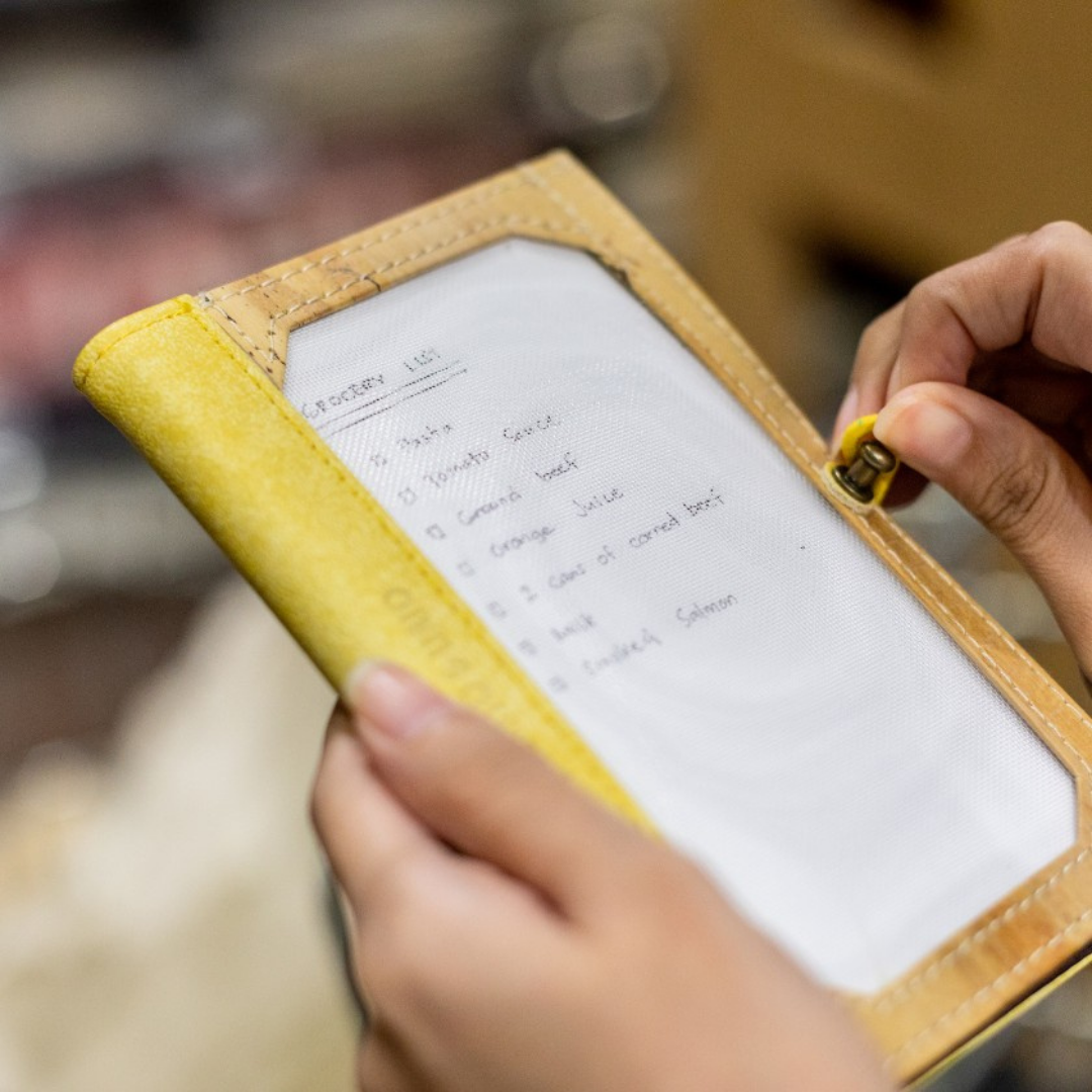 Pinto Mini Personalizable Passport Holder with a a travel wishlist on its insertable picture frame cover.