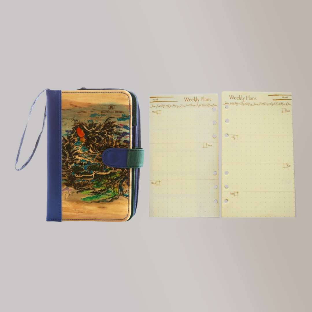 A vegan leather notebook next to two of its page refills.