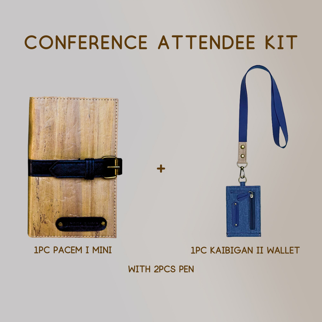 A mini vegan leather journal with a black leather belt buckle closure paired with a wallet ID lanyard in color blue, and two pens.