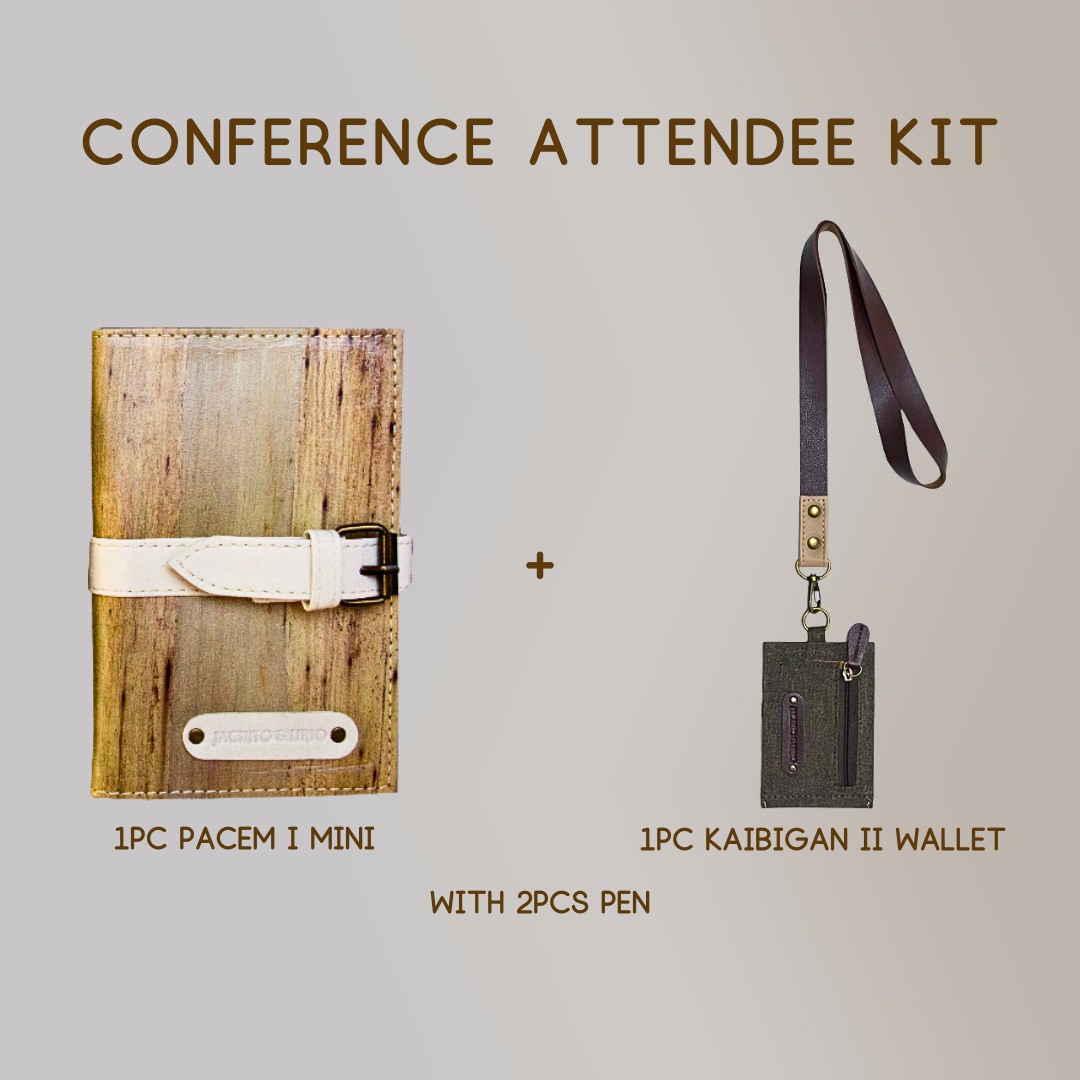 A mini vegan leather journal with a white leather belt buckle closure paired with a wallet ID lanyard in color gray, and two pens.