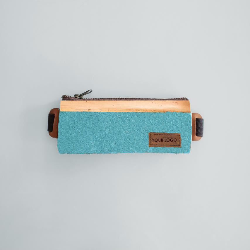 A plain sky blue rectangular pencil case made out of vegan leather.
