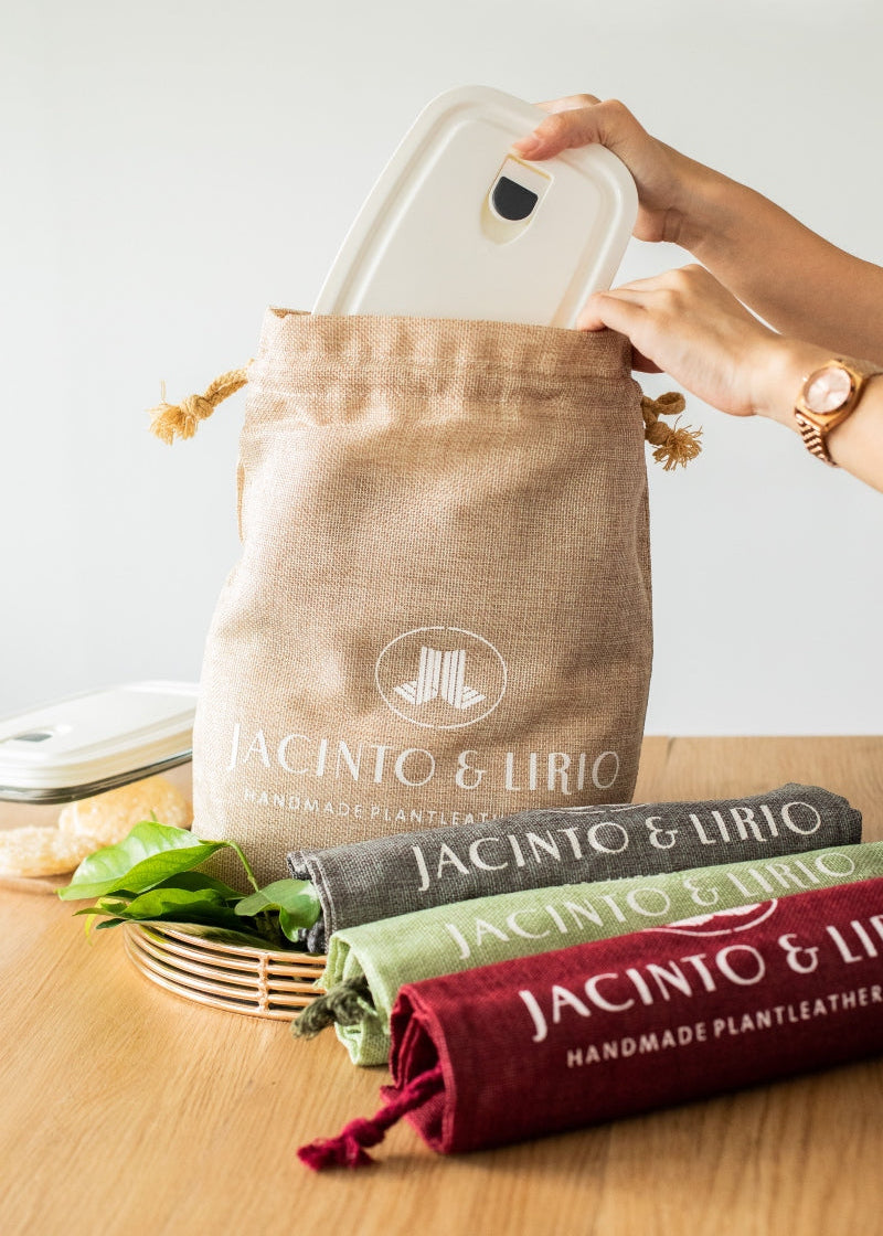 container being stored inside of linen drawstring eco bag.