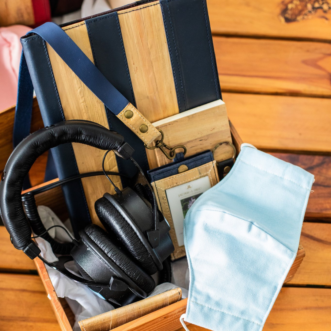 A gift set for an older brother with a blue color scheme containing black headphones, a blue cloth mask, a blue iPad case, and an ID lanyard