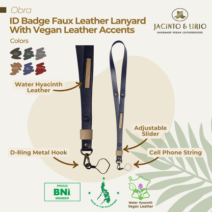 ID lanyard in a dark blue color with an adjustable slider, cell phone string, metal hook, and vegan leather accent on the straps.