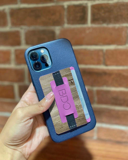 a phone with a multifunctional cellphone grip and card holder, featuring a purple strap and vegan leather design.