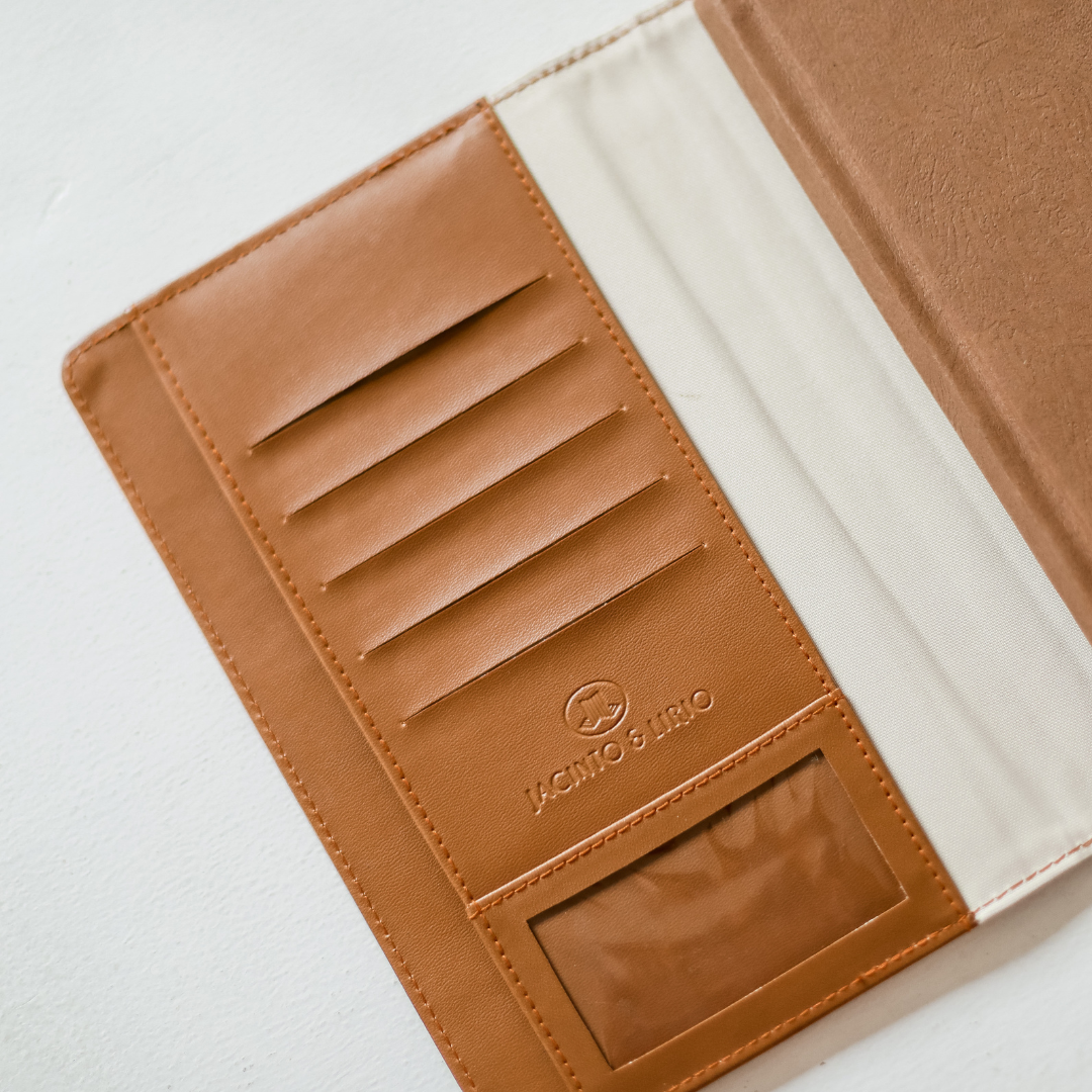 A brown vegan leather journal with card inserts.