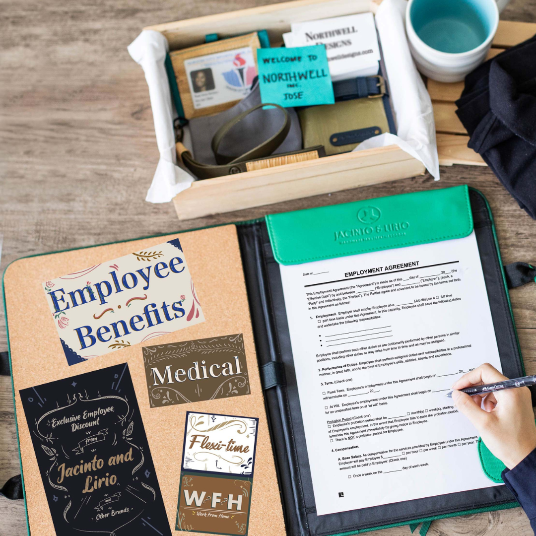 Open Jacinto & Lirio leather portfolio on a desk featuring an employment agreement being signed. Surrounding the portfolio are cards promoting employee benefits, including medical coverage, flexible work hours, and exclusive discounts. A welcome kit with a name tag, mug, and office supplies is visible in the background, creating a professional onboarding atmosphere.