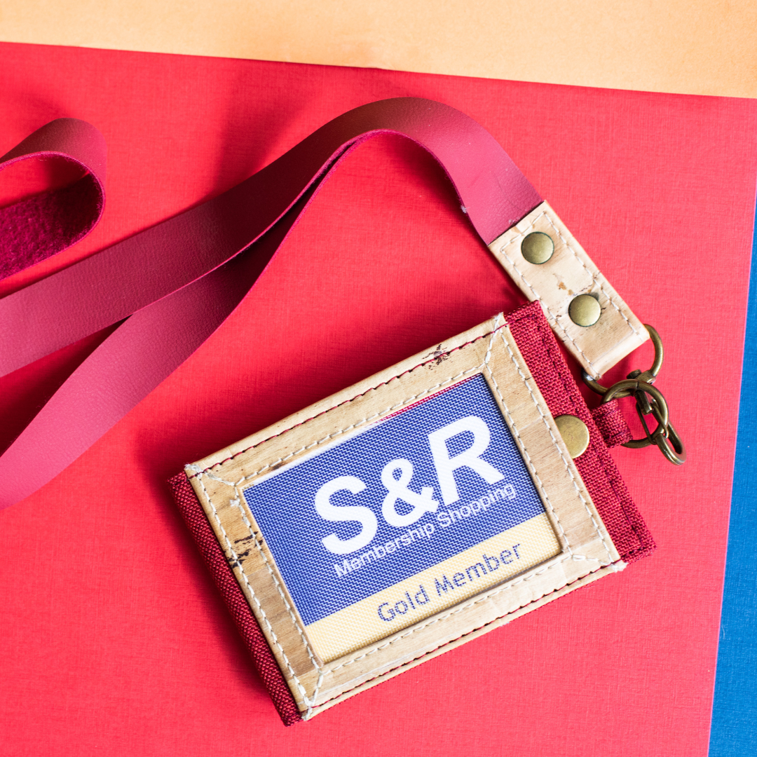 A red lanyard and ID holder with an S&R card inside