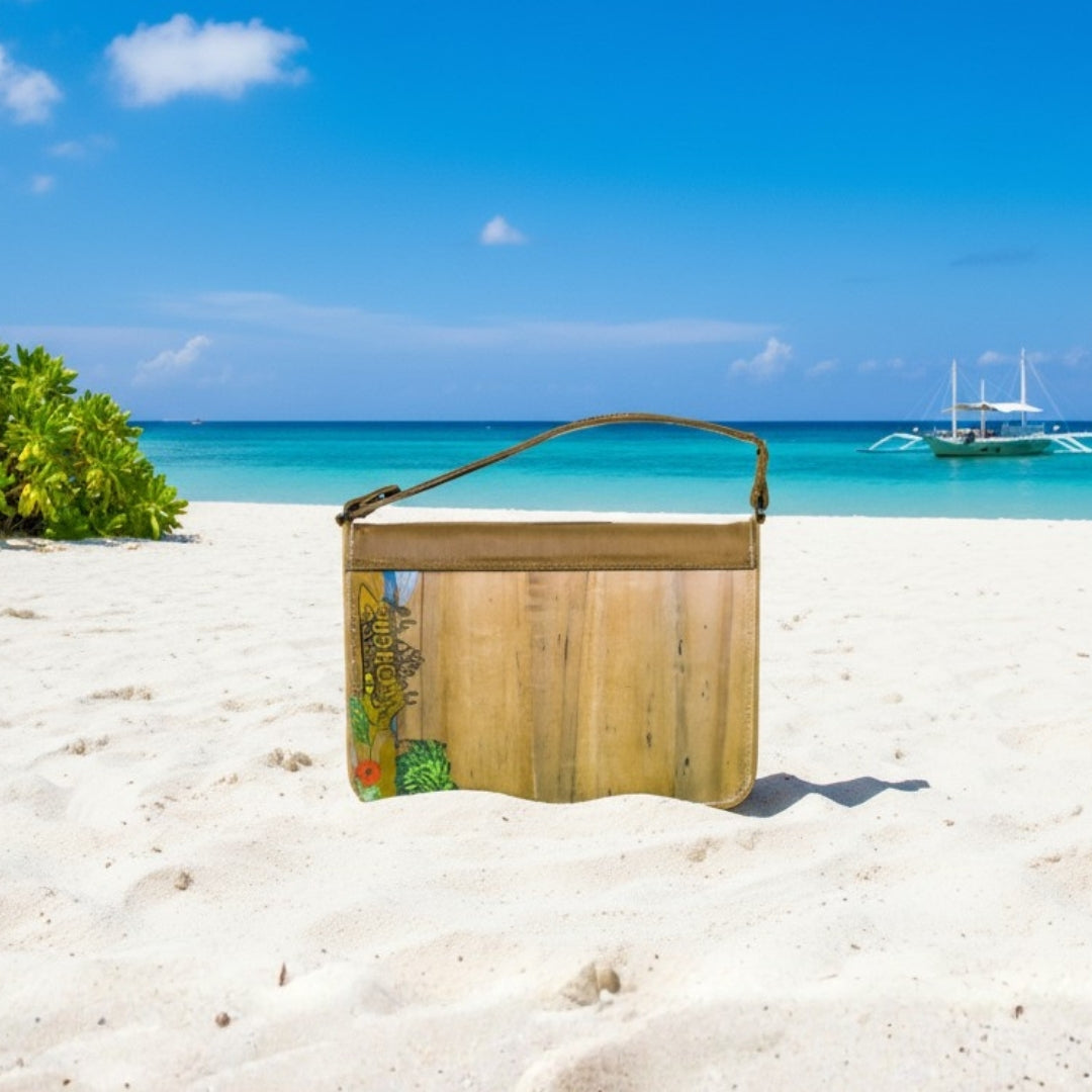 Gala Boracay on a sandy beach with turquoise water and a boat in the background.