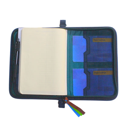 Gala Mayon family passport holder daily planner open with back of planner and two passbooks inserted.