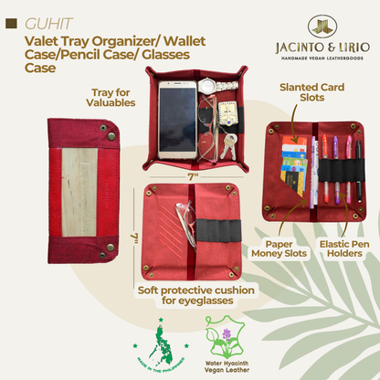 A multi-use and foldable red vegan leather valet tray.