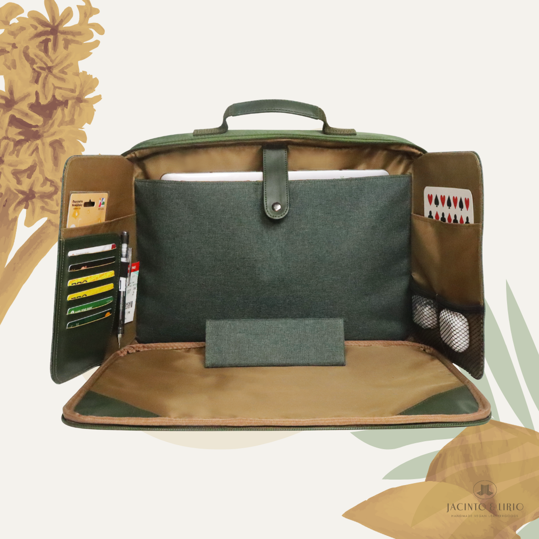 Open olive green and brown Hiraya Laptop bag with multiple varying secure compartments on a light background.