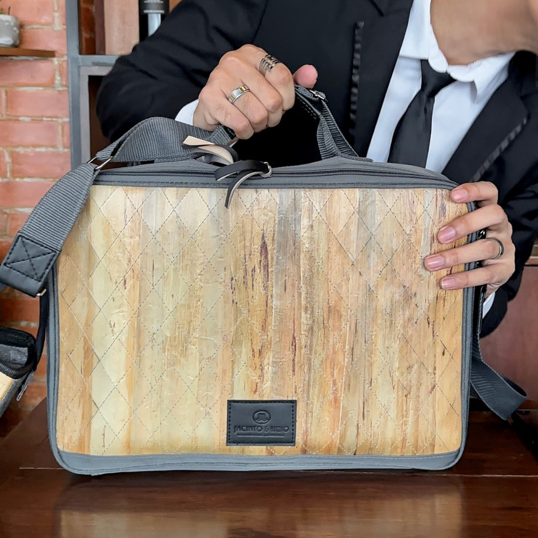 Businessman holding a Hiraya bag on the table.