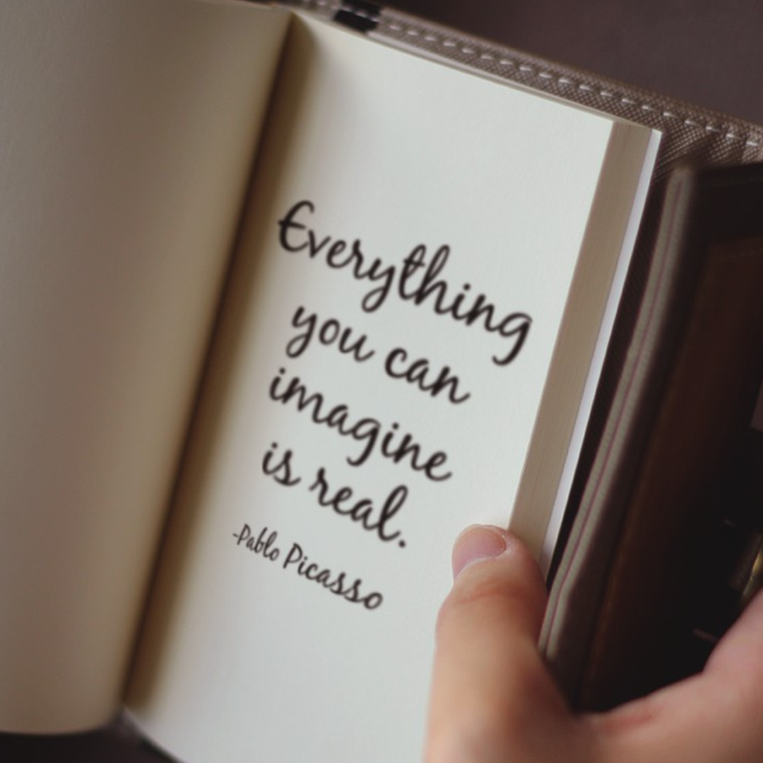 A quote written on a page in a brown notebook.