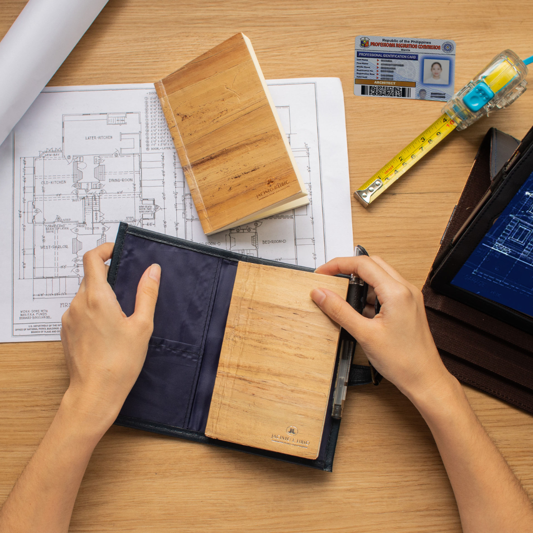 A vegan leather small notebook that is fabric and blue.