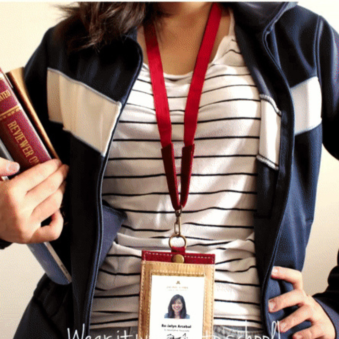 A red leather lanyard with a matching ID holder.
