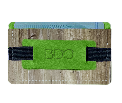 a card holder made of vegan leather featuring a piece of green leather in the center embossed with the BDO logo.