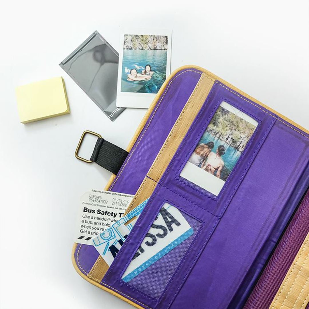A purple vegan leather journals with pockets that can hold pictures.