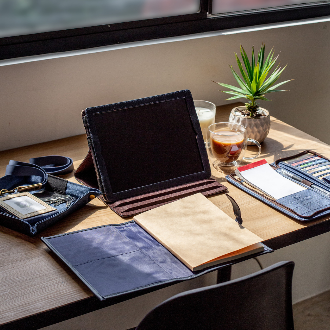 A iPad on a desktop apart of a workstation.