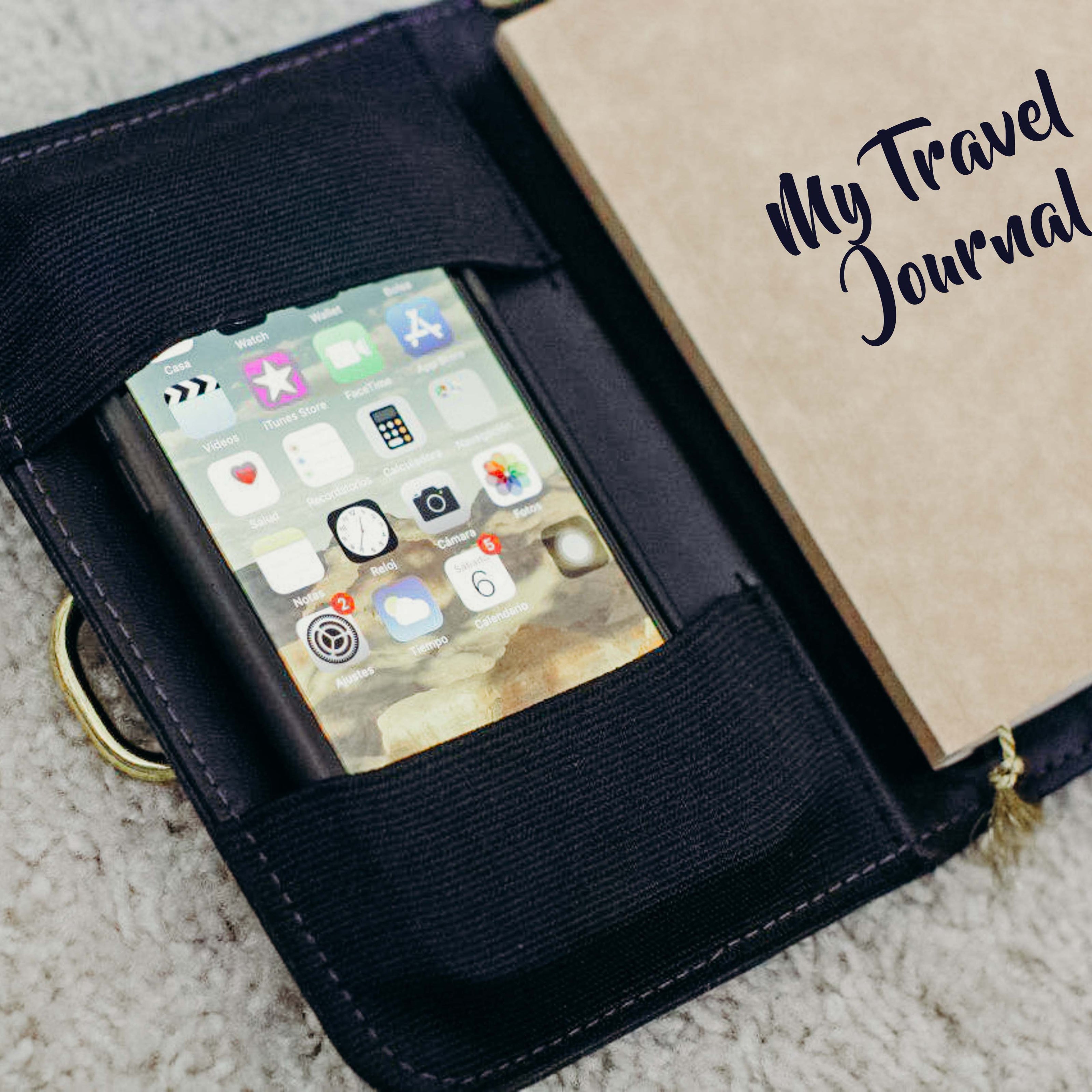 A journal that has an elastic pocket in its inner sleeve that can hold a phone.