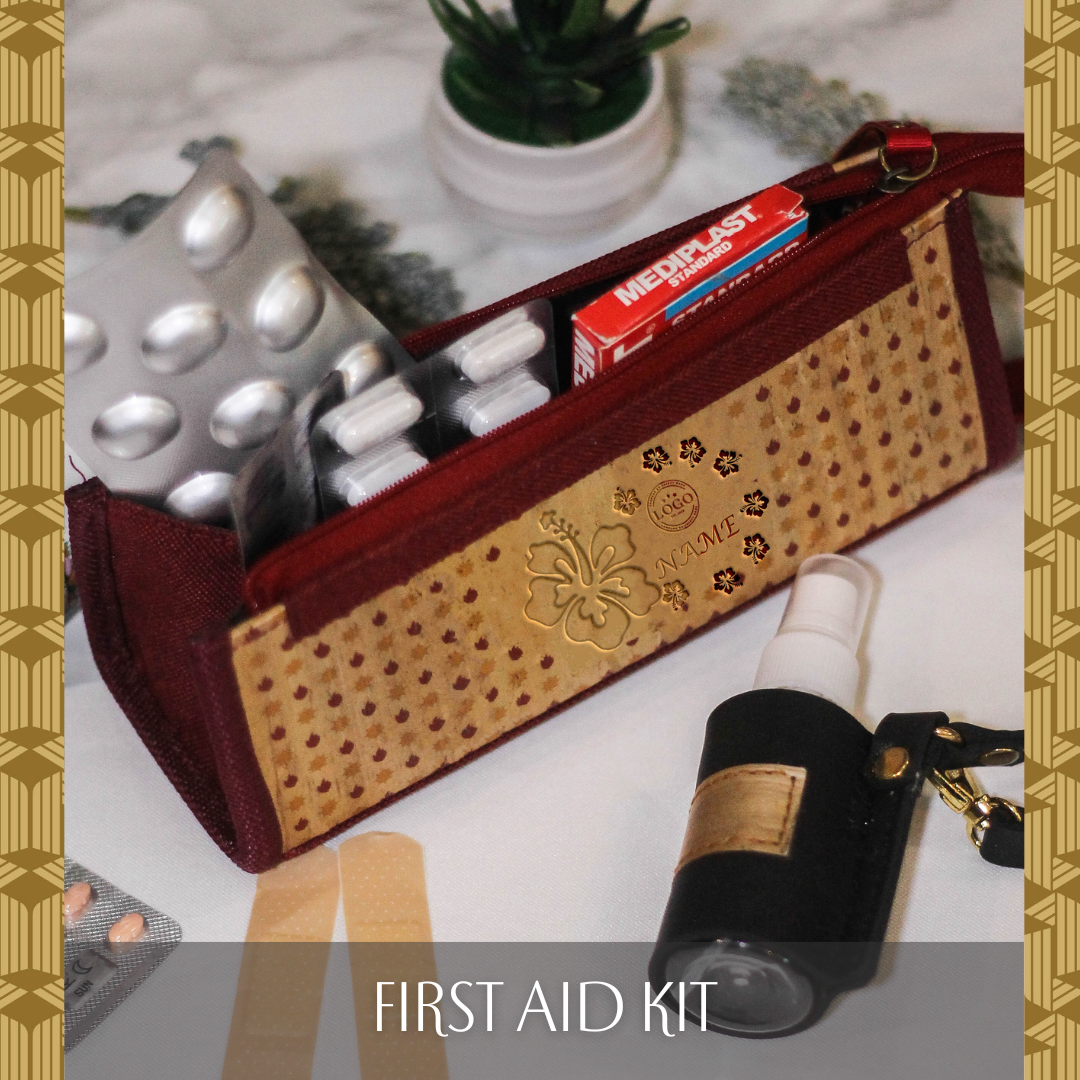 A red-hemmed vegan leather case that has artistic flower designs and a red and orange dotted design, containing pill medicines and a pack of bandaids inside.