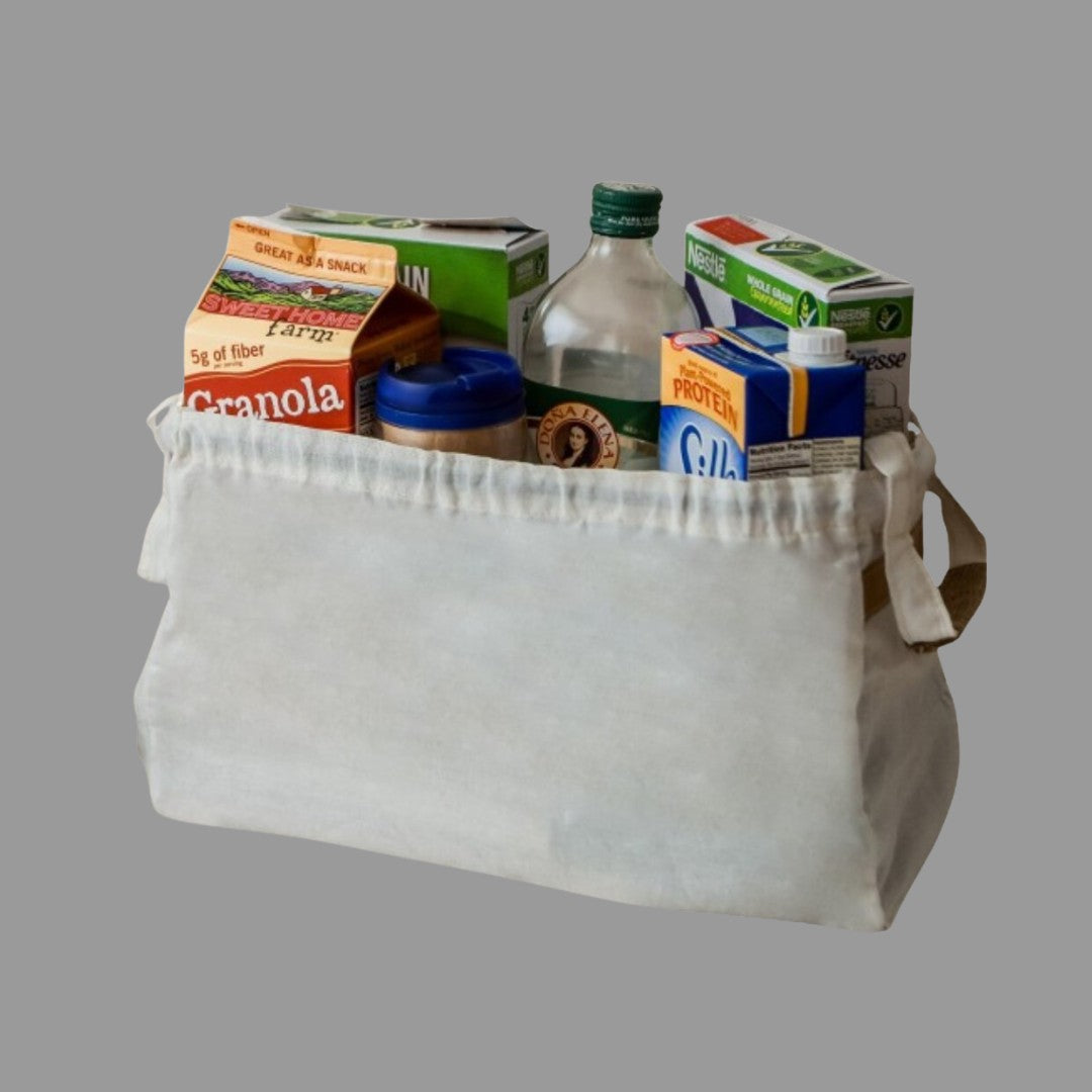 White Kanyamaso convertible tote bag filled with groceries, showing its large capacity.