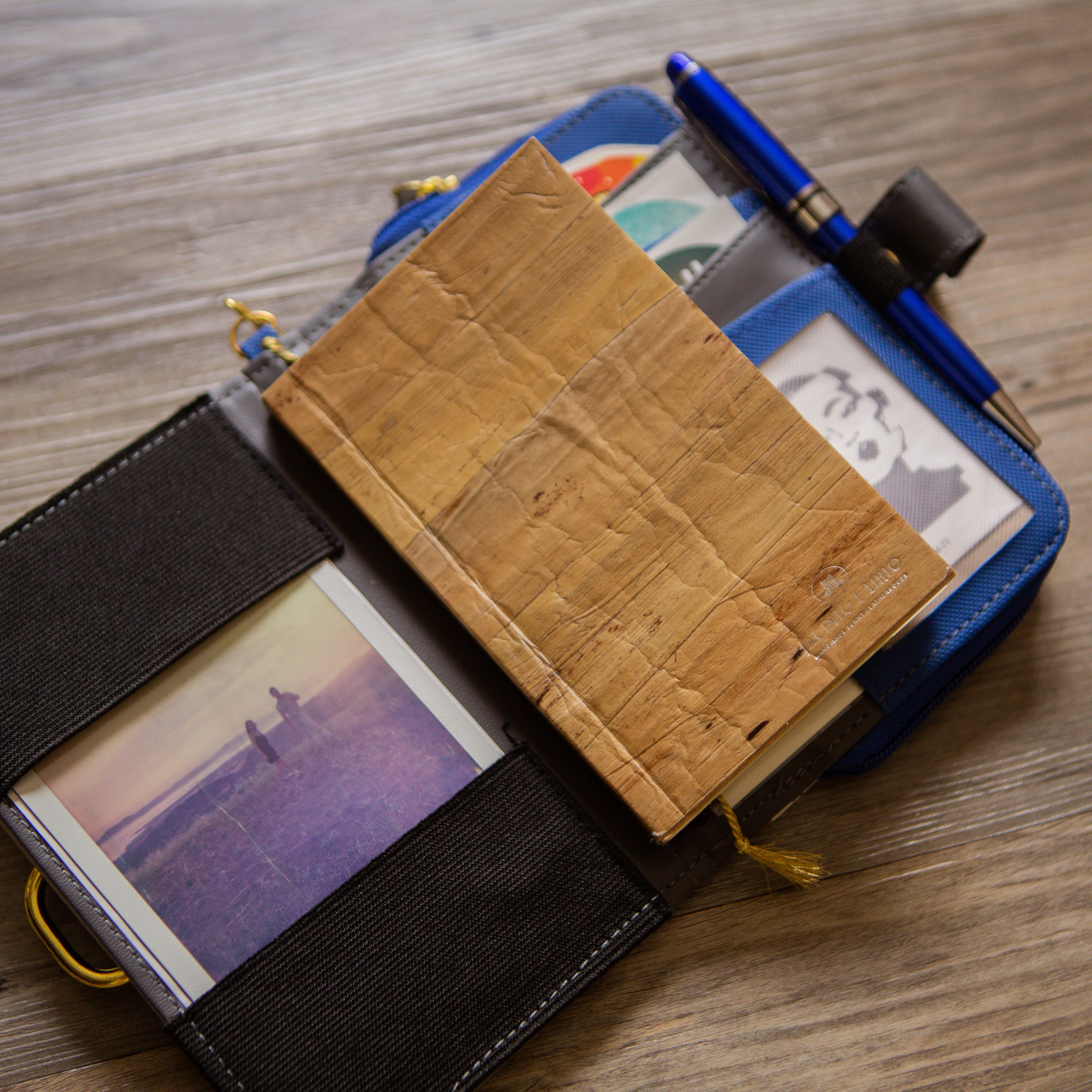 A vegan leather journal insert inside of a journal sleeve.